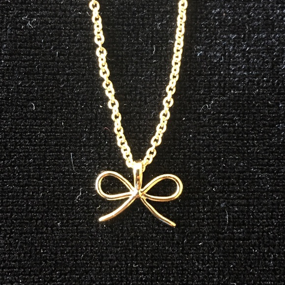 Gold colored metal bow necklace/pendant. - Picture 1 of 5